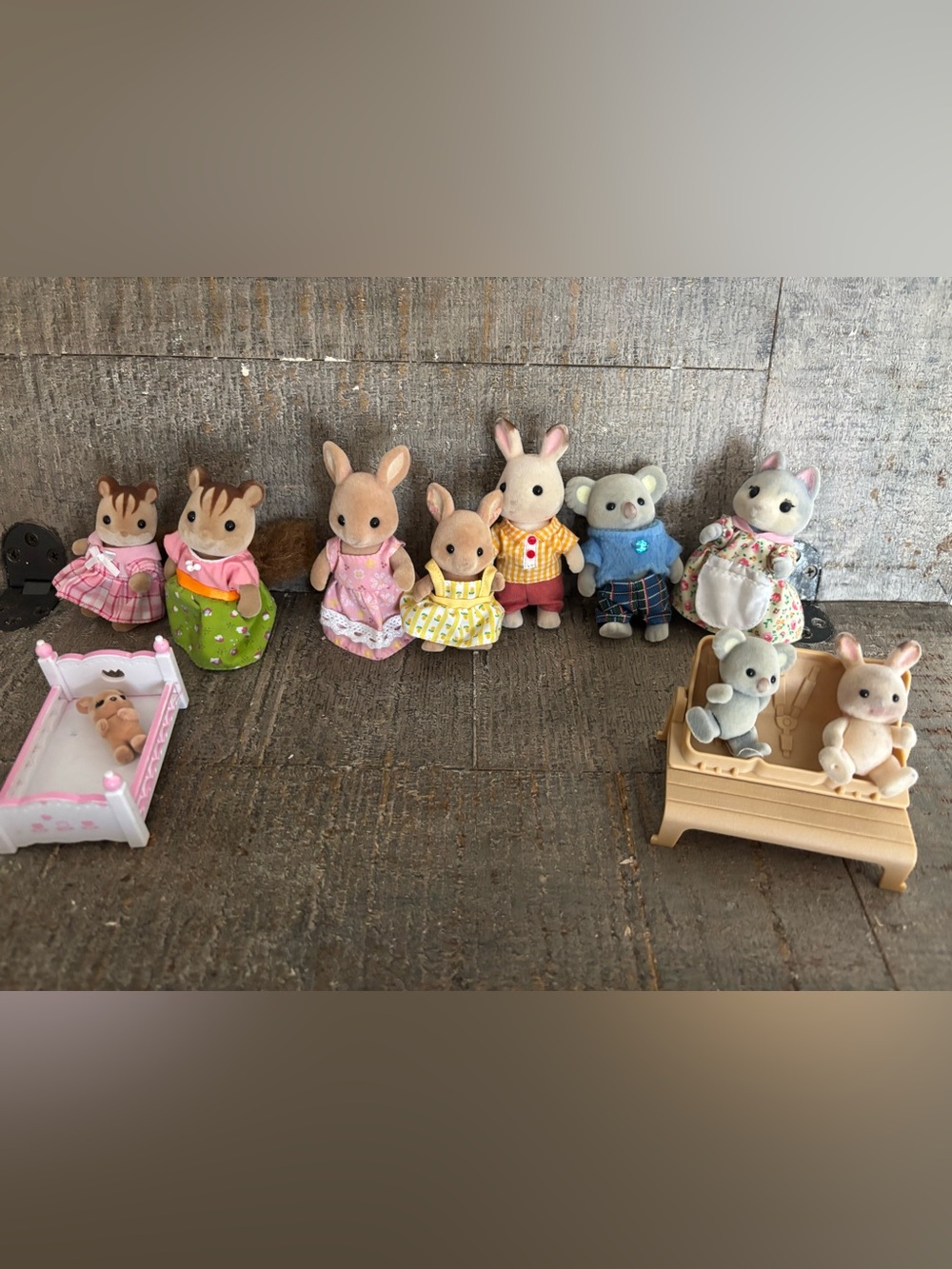 Calico critter assortment with 10 characters, a bed and bench